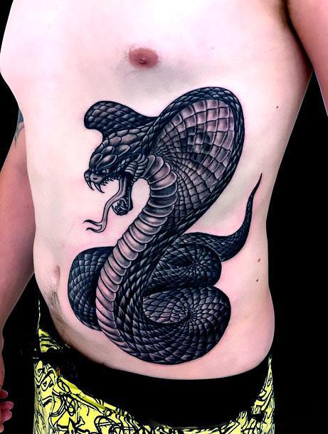 Traditional style cobra on stomach by Kevin Rodriguez in Sheboygan  Wisconsin. : r/tattoos