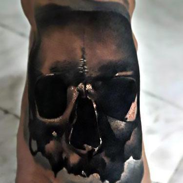 Black Skull on Foot Tattoo