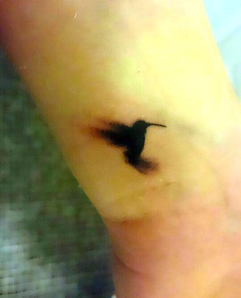 Black Tiny Hummingbird Tattoo Idea