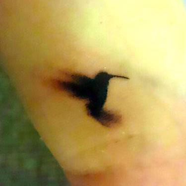 Black Tiny Hummingbird Tattoo