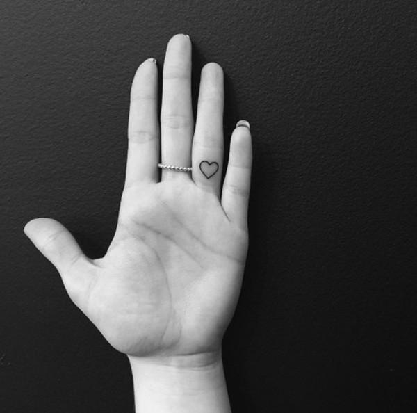 Tiny Heart On Finger Tattoo Idea