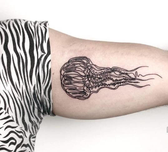 Jellyfish On Biceps Tattoo Idea