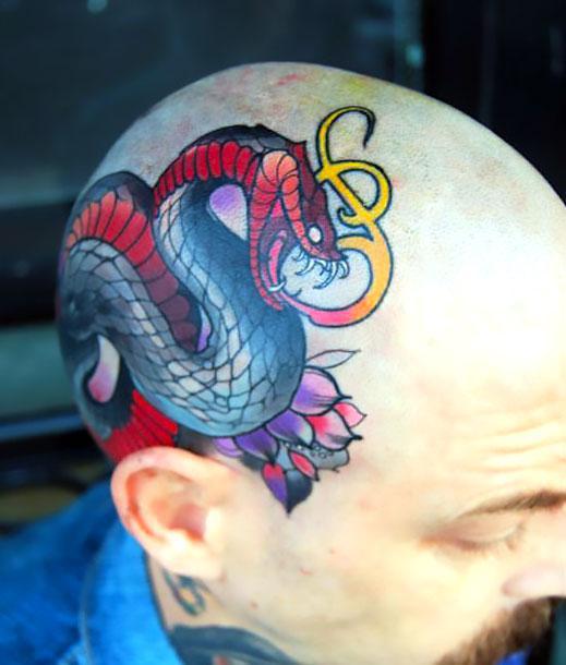 Black and Red Snake on Head Tattoo Idea