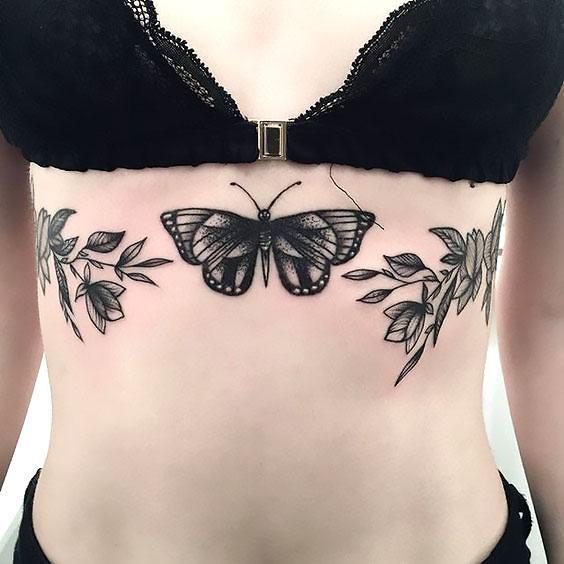 Black Butterfly on the Breast Tattoo Idea