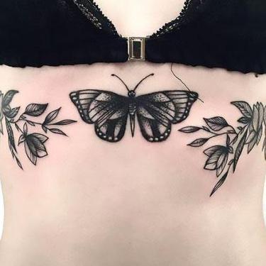 Black Butterfly on the Breast Tattoo