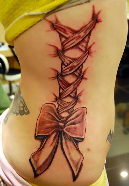 Bow on Ribs Tattoo Idea