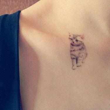 Tiny Realistic Kitty Tattoo