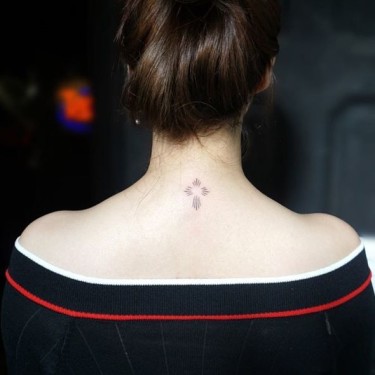 Female Linework Cross Tattoo