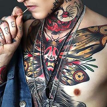 Butterfly With Skull on Upper Chest Tattoo