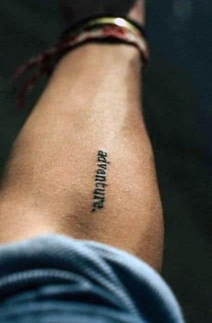 Men's Inner Forearm Minimalist Word - Adventure Tattoo Idea