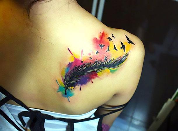 Colorful Watercolor Feather Tattoo Idea