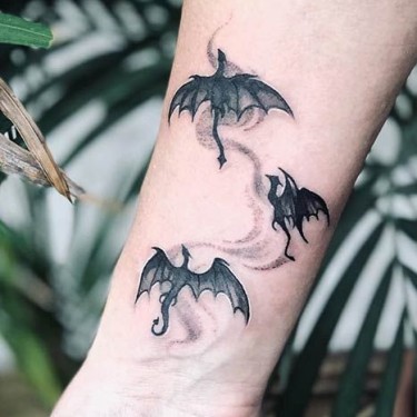 Three Little Black Dragons Tattoo