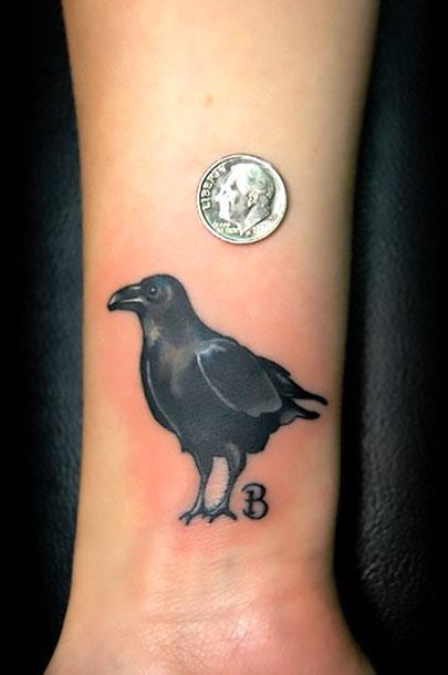 Cool Blackbird on Wrist Tattoo Idea