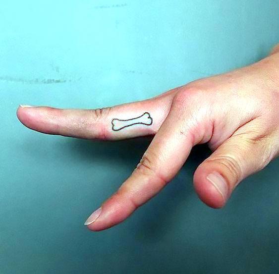 Dog Bone on Finger Tattoo Idea