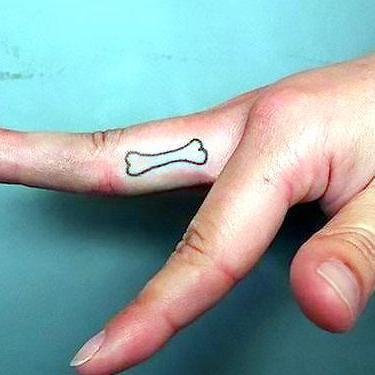 Dog Bone on Finger Tattoo