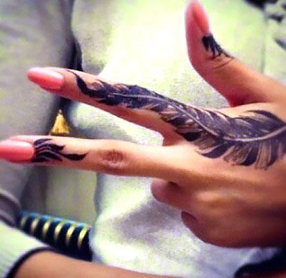 Cool Finger Feather Tattoo Idea
