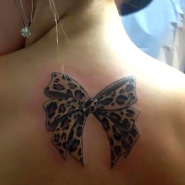 Leopard Bow on Back Tattoo