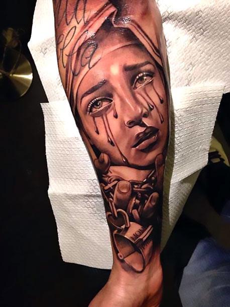 Crying woman tattoo meaning