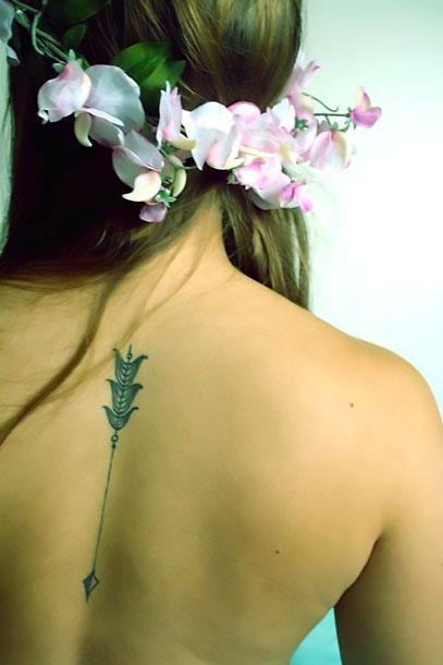 Cute Arrow on Spine Tattoo Idea