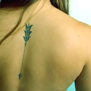 Cute Arrow on Spine Tattoo
