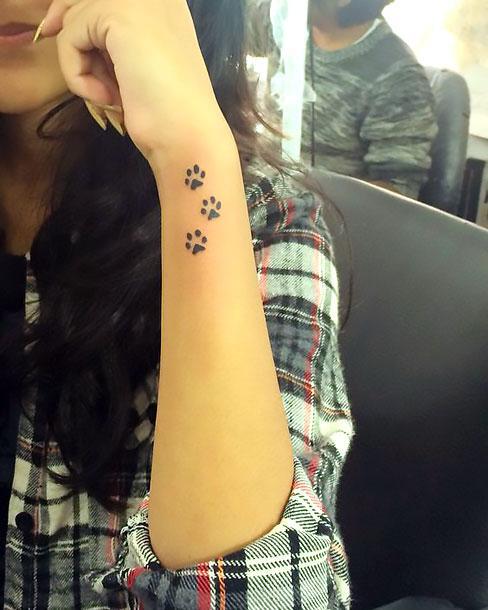 Puppy Paws Prints on Wrist Tattoo Idea