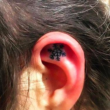 Cute Snowflake on Ear Tattoo