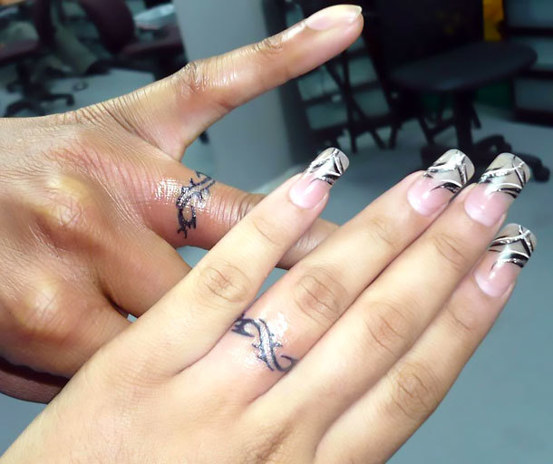 Wedding Rings on Figers Tattoo Idea