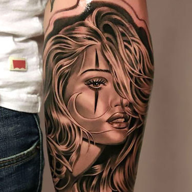 Girl Face on Forearm Tattoo