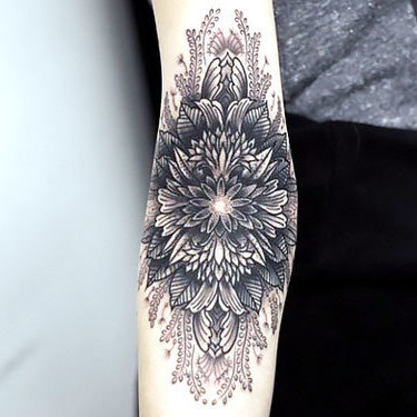 Great Flower on Elbow Tattoo