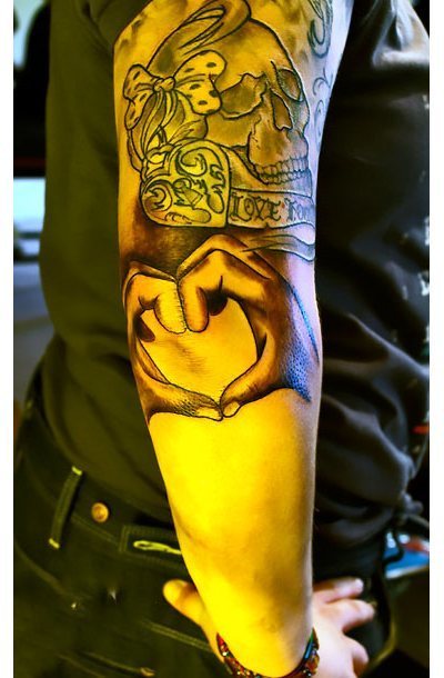 Hands on Elbow Tattoo Idea