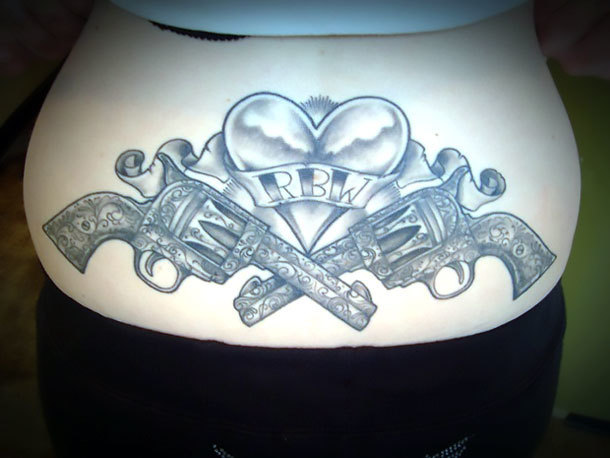Heart and Guns on Lower Back Tattoo Idea