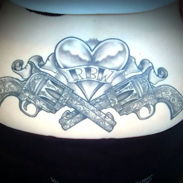 Heart and Guns on Lower Back Tattoo