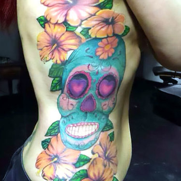 Hibiscus With Sugar Skull on Ribs Tattoo
