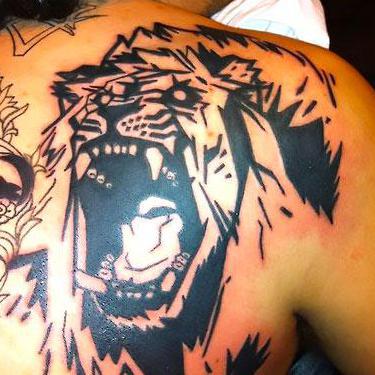 Angry Lion on Shoulder Blade Tattoo