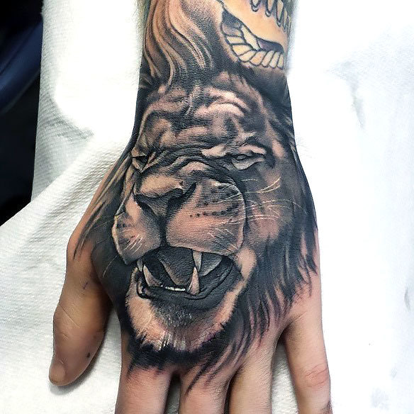 Lion on Hand Tattoo Idea