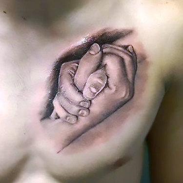 Locked Hands on Chest Tattoo