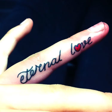 Love on Ring Finger Tattoo
