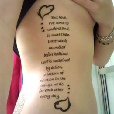 Love Quote on Rib Cage Tattoo