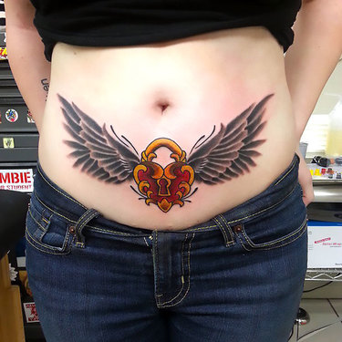 Winged Lock on Lower Stomach Tattoo