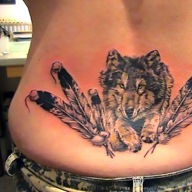 Wolf and Feathers on Lower Back Tattoo