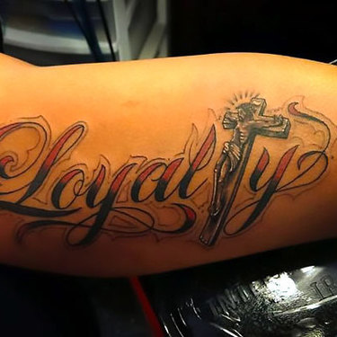 Loyalty on Inner Bicep Tattoo