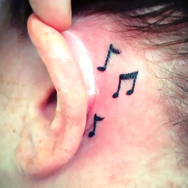 Musical Notes Behind Ear Tattoo