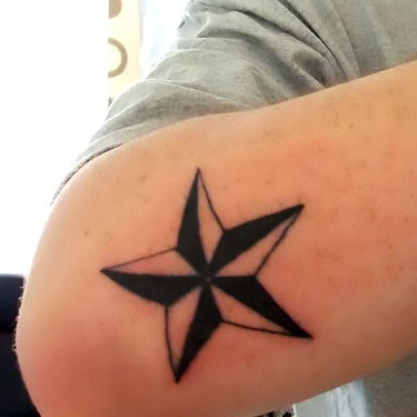Nautical Star on Elbow Tattoo