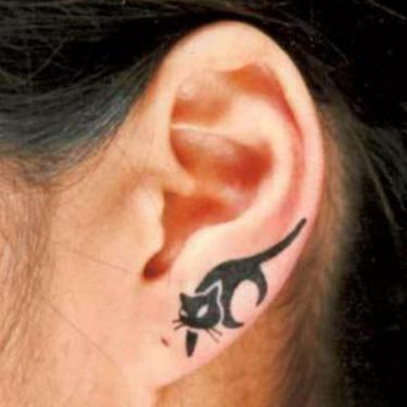 Tiny Cat on Ear Tattoo