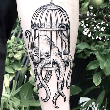 Octopus In Birdcage Tattoo