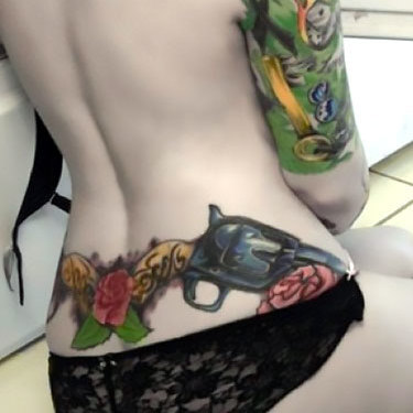 Tramp Stamp Gun Tattoo
