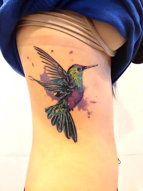 Awesome Hummingbird on Ribs Tattoo Idea