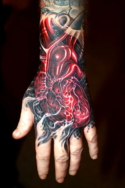 Red Heart on Hand Tattoo Idea
