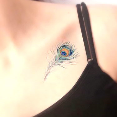 Peacock Feather on Collar Bone Tattoo