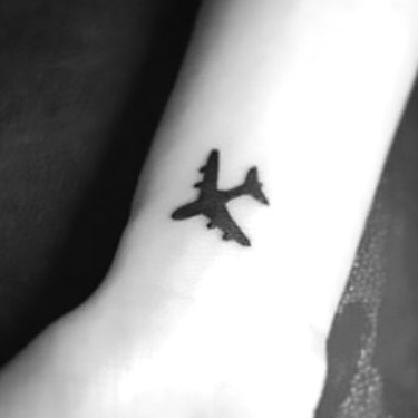 Simple Black Airplane Tattoo